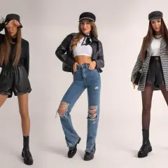 Trzy kobiety w modnych stylizacjach na koncert: skórzane szorty, jeansy z dziurami, marynarka.