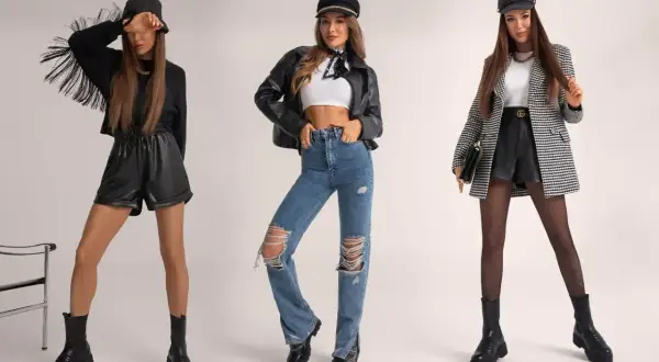 Trzy kobiety w modnych stylizacjach na koncert: skórzane szorty, jeansy z dziurami, marynarka.